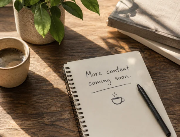 A notebook on coffee table with the note, more content coming soon